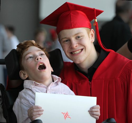 RUTH BONNEVILLE / WINNIPEG FREE PRESS

49.8 Feature: Class of  2017 Project:    
Griffin shares a touching moment with his younger brother, Tyler who has cerebral palsy, after receiving his diploma at his convocation ceremony.  

Final photos of The class of 2017 students (15),  on their graduation day from Glenlawn Collegiate.  Their convocation ceremony was held at The RBC Convention Centre on June 26th 2017 as well as their dinner and dance later that evening.  
See story on WFP's 13 year documentary on a group of students  who the Free Press followed and photographed from their 1st year in kindergarden in Windsor School to their graduating year in 2017 at Glenlawn Collegiate. 

See Doug Speirs story.  

June 26, 2017