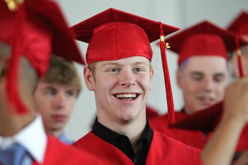 RUTH BONNEVILLE / WINNIPEG FREE PRESS

49.8 Feature: Class of  2017 Project:    
Griffin with his red cap and gown on at convocation ceremony.  

Final photos of The class of 2017 students (15),  on their graduation day from Glenlawn Collegiate.  Their convocation ceremony was held at The RBC Convention Centre on June 26th 2017 as well as their dinner and dance later that evening.  
See story on WFP's 13 year documentary on a group of students  who the Free Press followed and photographed from their 1st year in kindergarden in Windsor School to their graduating year in 2017 at Glenlawn Collegiate. 

See Doug Speirs story.  

June 26, 2017