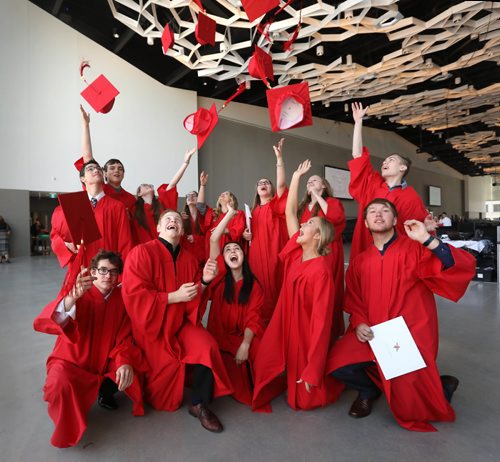 RUTH BONNEVILLE / WINNIPEG FREE PRESS

49.8 Feature: Class of  2017 Project:    
Group photo of 13 of the 15 "Class of 2017" students   (Noah, Thomas, , Quinn, Sarah, Julianna, Naomi,  Mackenzie,  Hailey, Avery, Garrett, Sydney Aby and Griffin), throw their grad caps into the air after their convocation ceremony.   (Jesse and Savanna not in photo)

Final photos of The class of 2017 students (15),  on their graduation day from Glenlawn Collegiate.  Their convocation ceremony was held at The RBC Convention Centre on June 26th 2017 as well as their dinner and dance later that evening.  
See story on WFP's 13 year documentary on a group of students  who the Free Press followed and photographed from their 1st year in kindergarden in Windsor School to their graduating year in 2017 at Glenlawn Collegiate. 

See Doug Speirs story.  

June 26, 2017