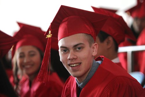 RUTH BONNEVILLE / WINNIPEG FREE PRESS

49.8 Feature: Class of  2017 Project:   
Avery with his red cap and gown on at convocation ceremony.   

Final photos of The class of 2017 students (15),  on their graduation day from Glenlawn Collegiate.  Their convocation ceremony was held at The RBC Convention Centre on June 26th 2017 as well as their dinner and dance later that evening.  
See story on WFP's 13 year documentary on a group of students  who the Free Press followed and photographed from their 1st year in kindergarden in Windsor School to their graduating year in 2017 at Glenlawn Collegiate. 

See Doug Speirs story.  

June 26, 2017