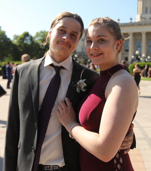 RUTH BONNEVILLE / WINNIPEG FREE PRESS

49.8 Feature: Class of  2017 Project:    
Mackenzie poses with her boyfriend Devon, who was originally part of the "Class of 2017" project in the early years, at the fountain behind the Legislative Building before attending their graduation dinner later that evening.  

Final photos of The class of 2017 students (15),  on their graduation day from Glenlawn Collegiate.  Their convocation ceremony was held at The RBC Convention Centre on June 26th 2017 as well as their dinner and dance later that evening.  
See story on WFP's 13 year documentary on a group of students  who the Free Press followed and photographed from their 1st year in kindergarden in Windsor School to their graduating year in 2017 at Glenlawn Collegiate. 

See Doug Speirs story.  

June 26, 2017