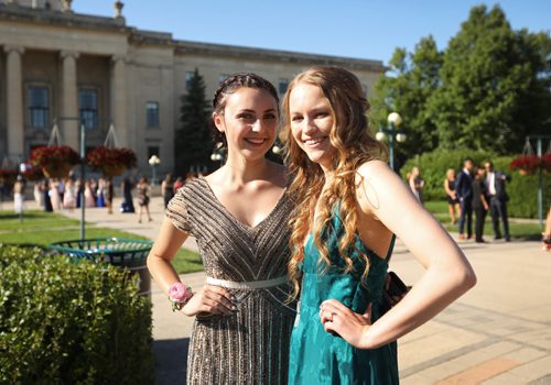 RUTH BONNEVILLE / WINNIPEG FREE PRESS

49.8 Feature: Class of  2017 Project:    
Aby (left) and Hailey, have photos taken with friends in their formal dress for  their graduation dinner at the fountain behind the Legislative Building.

Final photos of The class of 2017 students (15),  on their graduation day from Glenlawn Collegiate.  Their convocation ceremony was held at The RBC Convention Centre on June 26th 2017 as well as their dinner and dance later that evening.  
See story on WFP's 13 year documentary on a group of students  who the Free Press followed and photographed from their 1st year in kindergarden in Windsor School to their graduating year in 2017 at Glenlawn Collegiate. 

See Doug Speirs story.  

June 26, 2017