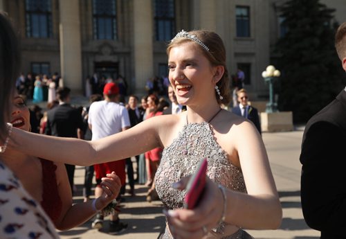 RUTH BONNEVILLE / WINNIPEG FREE PRESS

49.8 Feature: Class of  2017 Project:    
Savanna (who recently returned to Glenlawn for her graduating year) is greeted by friends at the fountain behind the Legislative Building before attending their graduation dinner later that evening.   
Final photos of The class of 2017 students (15),  on their graduation day from Glenlawn Collegiate.  Their convocation ceremony was held at The RBC Convention Centre on June 26th 2017 as well as their dinner and dance later that evening.  
See story on WFP's 13 year documentary on a group of students  who the Free Press followed and photographed from their 1st year in kindergarden in Windsor School to their graduating year in 2017 at Glenlawn Collegiate. 

See Doug Speirs story.  

June 26, 2017