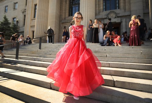 RUTH BONNEVILLE / WINNIPEG FREE PRESS

49.8 Feature: Class of  2017 Project:  
Julianna (who was part of the project but moved away than recently returned back to Winnipeg and graduated with her fellow students) makes her way down the steps behind the Legislative Building before attending their graduation dinner later that evening.  
  

Final photos of The class of 2017 students (15),  on their graduation day from Glenlawn Collegiate.  Their convocation ceremony was held at The RBC Convention Centre on June 26th 2017 as well as their dinner and dance later that evening.  
See story on WFP's 13 year documentary on a group of students  who the Free Press followed and photographed from their 1st year in kindergarden in Windsor School to their graduating year in 2017 at Glenlawn Collegiate. 

See Doug Speirs story.  

June 26, 2017