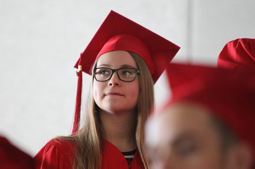 RUTH BONNEVILLE / WINNIPEG FREE PRESS

49.8 Feature: Class of  2017 Project:    
Mackenzie  with her red cap and gown on at convocation ceremony.  

Final photos of The class of 2017 students (15),  on their graduation day from Glenlawn Collegiate.  Their convocation ceremony was held at The RBC Convention Centre on June 26th 2017 as well as their dinner and dance later that evening.  
See story on WFP's 13 year documentary on a group of students  who the Free Press followed and photographed from their 1st year in kindergarden in Windsor School to their graduating year in 2017 at Glenlawn Collegiate. 

See Doug Speirs story.  

June 26, 2017