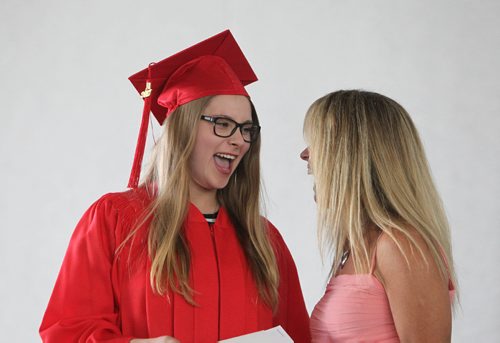 RUTH BONNEVILLE / WINNIPEG FREE PRESS

49.8 Feature: Class of  2017 Project:    
Mackenzie  is all smiles as she receives her diploma with her red cap and gown on at convocation ceremony.  

Final photos of The class of 2017 students (15),  on their graduation day from Glenlawn Collegiate.  Their convocation ceremony was held at The RBC Convention Centre on June 26th 2017 as well as their dinner and dance later that evening.  
See story on WFP's 13 year documentary on a group of students  who the Free Press followed and photographed from their 1st year in kindergarden in Windsor School to their graduating year in 2017 at Glenlawn Collegiate. 

See Doug Speirs story.  

June 26, 2017