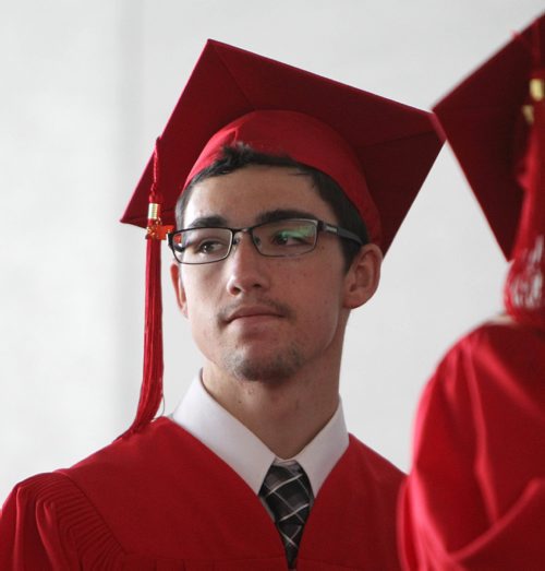 RUTH BONNEVILLE / WINNIPEG FREE PRESS

49.8 Feature: Class of  2017 Project:    
Thomas waits in line to receive his diploma with his red cap and gown on at convocation ceremony.  

Final photos of The class of 2017 students (15),  on their graduation day from Glenlawn Collegiate.  Their convocation ceremony was held at The RBC Convention Centre on June 26th 2017 as well as their dinner and dance later that evening.  
See story on WFP's 13 year documentary on a group of students  who the Free Press followed and photographed from their 1st year in kindergarden in Windsor School to their graduating year in 2017 at Glenlawn Collegiate. 

See Doug Speirs story.  

June 26, 2017