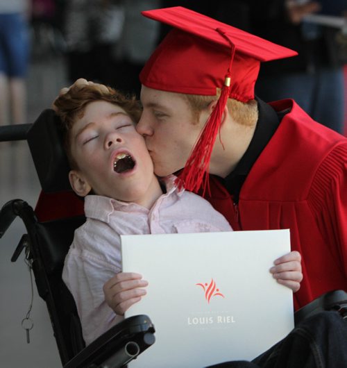 RUTH BONNEVILLE / WINNIPEG FREE PRESS

49.8 Feature: Class of  2017 Project:    
Griffin shares a touching moment with his younger brother, Tyler who has cerebral palsy, after receiving his diploma at his convocation ceremony.  

Final photos of The class of 2017 students (15),  on their graduation day from Glenlawn Collegiate.  Their convocation ceremony was held at The RBC Convention Centre on June 26th 2017 as well as their dinner and dance later that evening.  
See story on WFP's 13 year documentary on a group of students  who the Free Press followed and photographed from their 1st year in kindergarden in Windsor School to their graduating year in 2017 at Glenlawn Collegiate. 

See Doug Speirs story.  

June 26, 2017