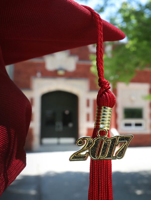 RUTH BONNEVILLE / WINNIPEG FREE PRESS

49.8 Feature: Class of  2017 Project:    
Photo of just 2017 tassel and cap with Windsor School in behind it.  

Final photos of The class of 2017 students (15),  on their graduation day from Glenlawn Collegiate.  Their convocation ceremony was held at The RBC Convention Centre on June 26th 2017 as well as their dinner and dance later that evening.  
See story on WFP's 13 year documentary on a group of students  who the Free Press followed and photographed from their 1st year in kindergarden in Windsor School to their graduating year in 2017 at Glenlawn Collegiate. 

See Doug Speirs story.  

June 26, 2017