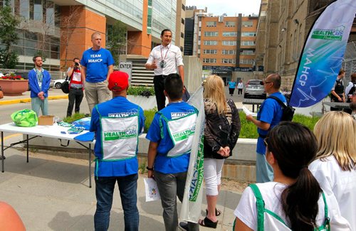 BORIS MINKEVICH / WINNIPEG FREE PRESS
The Manitoba Association of Health Care Professionals is held a Walk in Support of Patient Services at the HSC campus on 
McDermot Ave. Unions and political leaders were there. In this photo Wab Kinew, in white shirt, rally's the crowd. June 29, 2017
