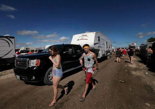 PHIL HOSSACK / WINNIPEG FREE PRESS  -  Festival goers and the temperature both heated up as the sun came oput Friday afternon at Dauphin's Country Festival. Festival goers and RV's arrive in the camper village surrounding the COuntry Fest sight north of Dauphin. Keith Urban takes the stage at ten tonight.   -  June 30 2017