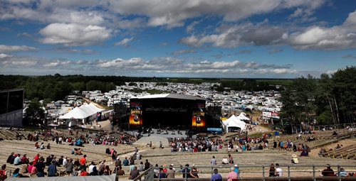 PHIL HOSSACK / WINNIPEG FREE PRESS  -  Festival goers and the temperature both heated up as the sun came oput Friday afternon at Dauphin's Country Festival. Panoramic view from the top of the grandstand at the main stage with the camper village wrapped all around the back of the site. Keith Urban takes the stage at ten tonight.   -  June 30 2017