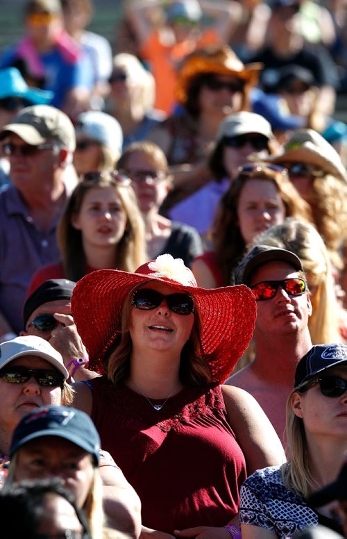 PHIL HOSSACK / WINNIPEG FREE PRESS  -  Festival goers and the temperature both heated up as the sun came oput Friday afternon at Dauphin's Country Festival. Canada Day red was the colour du jour in the grandstand Friday as country fans settled in for a night of entertainment. Keith Urban takes the stage at ten tonight.   -  June 30 2017