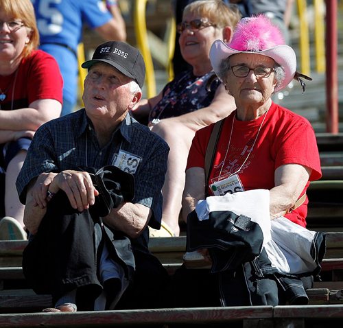 PHIL HOSSACK / WINNIPEG FREE PRESS  -  Festival goers and the temperature both heated up as the sun came oput Friday afternon at Dauphin's Country Festival. John and Doreen Murray get settled in at the main stage grandstand, the St Rose couple live nearby and attend the festival "occasionally". Keith Urban takes the stage at ten tonight.   -  June 30 2017