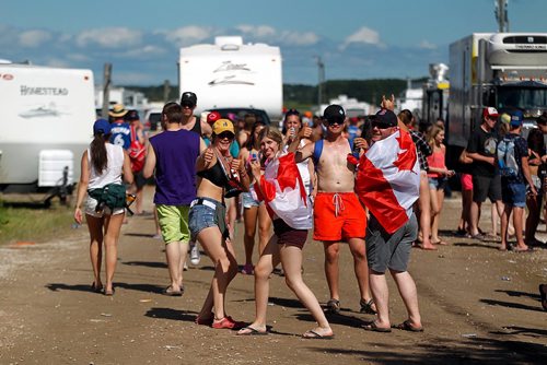 PHIL HOSSACK / WINNIPEG FREE PRESS  -  Festival goers and the temperature both heated up as the sun came oput Friday afternon at Dauphin's Country Festival. Fans roamed the camper village surrounding the main stage with beverages while RV's filed in behind. Keith Urban takes the stage at ten tonight.   -  June 30 2017