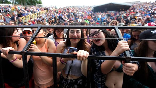 PHIL HOSSACK / WINNIPEG FREE PRESS  -   Fans crush up against the barriers in front of the stage Friday evening as Meghan Patrick took the stage to warm up the crowd for Keith Urban who took the stage  at ten tonight.   -  June 30 2017