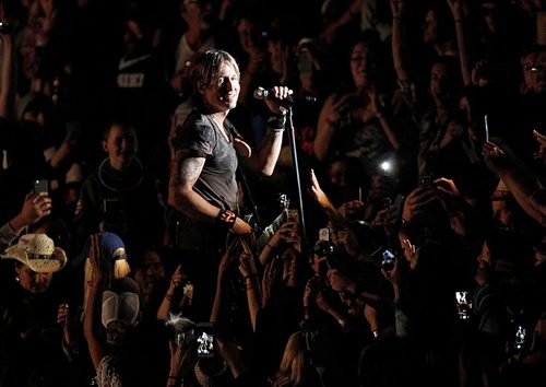 PHIL HOSSACK / WINNIPEG FREE PRESS  -   Keith Urban made his way up into the centre of the crowd Friday night at Dauphin's Country Festival.   -  June 30 2017