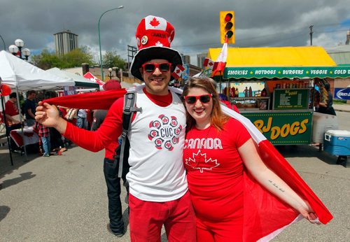 BORIS MINKEVICH / WINNIPEG FREE PRESS
Osborne Village Canada Day street festival was packed with people. From left, Aaron Klymasz-Swartz and Kyana Harper celebrate Canada Day by dressing up. July 1, 2017
