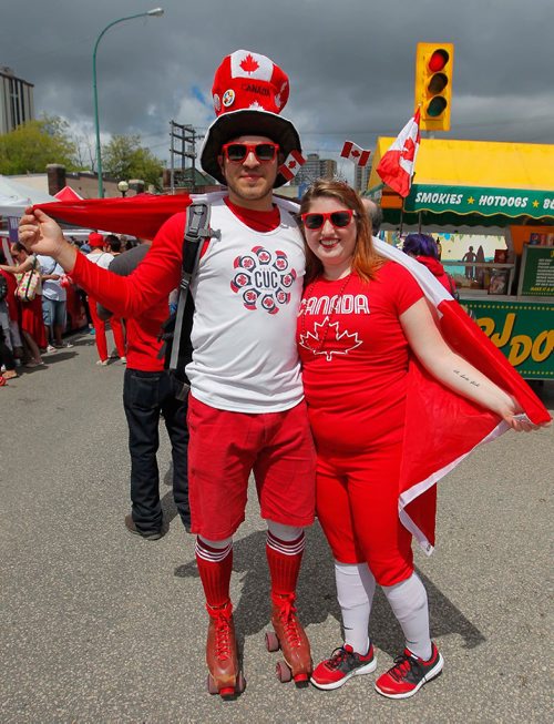 BORIS MINKEVICH / WINNIPEG FREE PRESS
Osborne Village Canada Day street festival was packed with people. From left, Aaron Klymasz-Swartz and Kyana Harper celebrate Canada Day by dressing up. July 1, 2017
