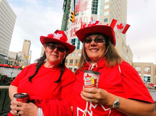 BORIS MINKEVICH / WINNIPEG FREE PRESS
3,600 proud Winnipeggers joined together bright and early at Portage & Main to create a human flag celebrating Canada Day. From left, Claudette Delorme and Lorraine Kahler at the event. July 1, 2017
