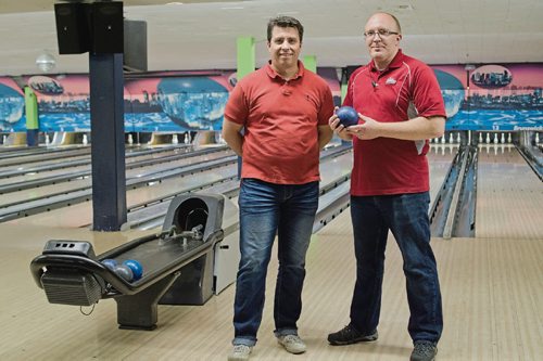 Canstar Community News June 28, 2017 -President of Academy Lanes Todd Britton and longtime manager Nathan Hogg are pictured on the first floor of the bowling alley at 394 Academy Rd. The bowling centre will close in September. (DANIELLE DA SILVA/SOUWESTER/CANSTAR)