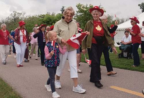 Canstar Community News June 28, 2017 - Over 40 seniors, accompanied by their grandchildren, took part in a parade from the corner of Henderson Highway and Chief Peguis Trail along the Chief Peguis Greenway to Millenium Gardens to celebrate Canada's sesquicentennial. (SHELDON BIRNIE/CANSTAR/THE HERALD)