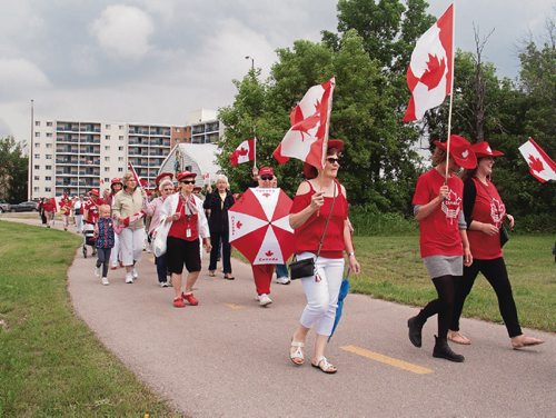 Canstar Community News June 28, 2017 - Over 40 people took part in a parade from the corner of Henderson Highway and Chief Peguis Trail along the Chief Peguis Greenway to Millenium Gardens to celebrate Canada's sesquicentennial. (SHELDON BIRNIE/CANSTAR/THE HERALD)