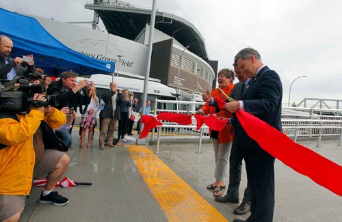 BORIS MINKEVICH / WINNIPEG FREE PRESS
Stadium Station at Investors Group Field. Opening of Stadium Station, the first piece of the Southwest Transitway Stage 2. From left cutting the official ribbon, Councillor South Winnipeg  St.Norbert Ward Janice Lukes, Winnipeg Mayor Brian Bowman and Member of Parliament for Winnipeg South Terry Duguid. CAROL SANDERS STORY. July 4, 2017
