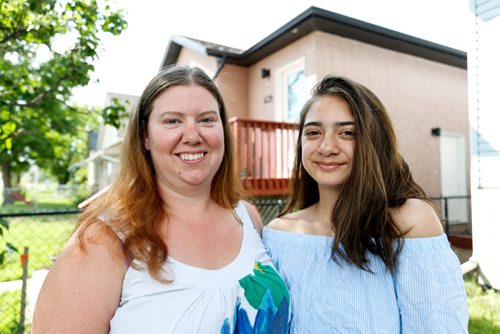 JUSTIN SAMANSKI-LANGILLE / WINNIPEG FREE PRESS
14 year-old Paige Ortiz (R) and her mother, Nicole Abbott pose on their front lawn Tuesday. Oritz has used the Sunshine Fund 5 times and says she enjoys camp because she gets to meet new people and learn about God.
170704 - Tuesday, July 04, 2017.