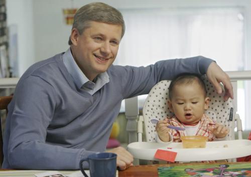Prime Minister Stephen Harper has breakfast with 14 month old Eric Huang during a campaign stop in Richmond, BC, September 9, 2008. Canandians go to the polls in a Federal election October 14. Lyle Stafford For the Winnipeg Free Press