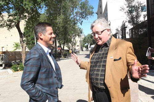 JOE BRYKSA / WINNIPEG FREE PRESSMayor Brian Bowman, left, and St James MLA Scott Johnston chat on the newly renovated John Hirsch Place Thursday to show off the improvements made to the Northeast Exchange district- The city and province worked together since 2012 to complete  $14 Million of improvements including underground road infrastructure, enhancing pedestrian realm with wider sidewalks, planting 130 trees, new lighting, and a innovative drainage design pilot on John Hirsch Place  .    -  July 06 , 2017 -( See Ryan Thorpe story)