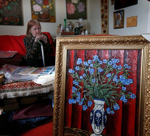 WAYNE GLOWACKI / WINNIPEG FREE PRESS

Undiscovered artist and would-be published author Grazyna (Grace) Brown surrounded by her art work in her home in the North End. In the foreground is a oil painting of Forget-me-not flowers. Gord Sinclair  story  July 6  2017