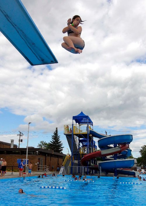 BORIS MINKEVICH / WINNIPEG FREE PRESS
Weather standup - The Transcona Aquatic Park. 
Claudia Osipiak-Radai,11, jumps off the high diving board to escape the summer heat this afternoon. Her sister Alexandra, 13, is in the pool waiting for her. July 6, 2017
