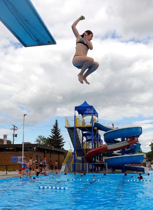 BORIS MINKEVICH / WINNIPEG FREE PRESS
Weather standup - The Transcona Aquatic Park. 
Claudia Osipiak-Radai,11, jumps off the high diving board to escape the summer heat this afternoon. July 6, 2017
