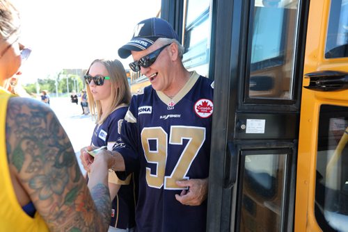 RUTH BONNEVILLE / WINNIPEG FREE PRESS

Winnipeg Blue Bomber fans are all smiles as they get off the shuttle bus at new bus terminal at Investors Group Stadium  for the first game Friday evening. 



July 07, 2017