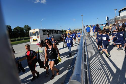 RUTH BONNEVILLE / WINNIPEG FREE PRESS

Winnipeg Blue Bomber fans make their way to the stadium after  taking the bus shuttle and getting dropped off at new terminal for the first game at Investors Group Field Friday evening. 




July 07, 2017