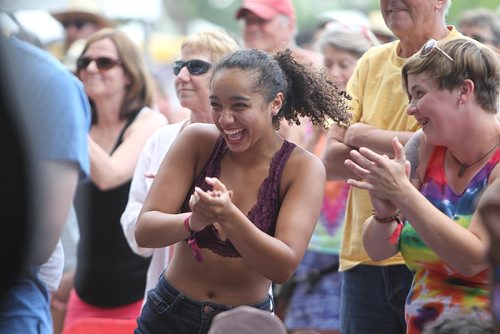 RUTH BONNEVILLE / WINNIPEG FREE PRESS

Kari Johnson (curly hair, centre) dances and claps with the band on stage with her friend Amanda Murphy (rainbow shirt) beside her at the 44th annual Folk Festival at Birds Hill Park Saturday.  

July 08, 2017
