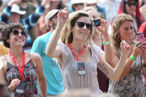 RUTH BONNEVILLE / WINNIPEG FREE PRESS

Tara Taronno dances with thousands of others as they listen to the performers on stage  at the 44th annual Folk Festival at Birds Hill Park Saturday.  

July 08, 2017