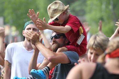 RUTH BONNEVILLE / WINNIPEG FREE PRESS

Scott Nystrom dances with his nephew (8yrs), on his shoulder while listening to the band Wesli on stage at the  annual Folk Festival at Birds Hill Park Saturday.  (no name for nephew).

July 08, 2017