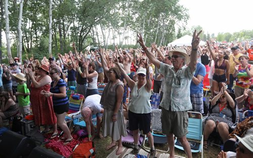 RUTH BONNEVILLE / WINNIPEG FREE PRESS

Wesli band perfumes on stage as thousands gather to listen and dance   at the 44th annual Folk Festival at Birds Hill Park Saturday.  

July 08, 2017