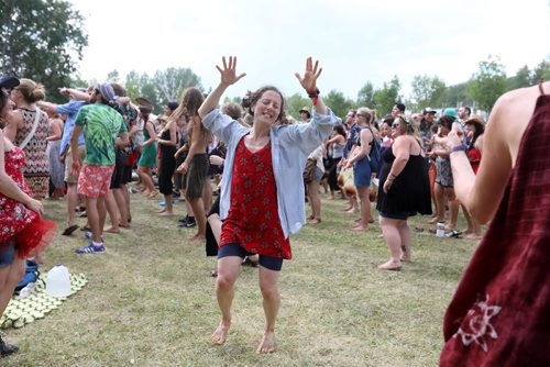 RUTH BONNEVILLE / WINNIPEG FREE PRESS

Kat Rother dances with friends near the stage  as  thousands gather to listen to performers at the 44th annual Folk Festival at Birds Hill Park Saturday.  

July 08, 2017