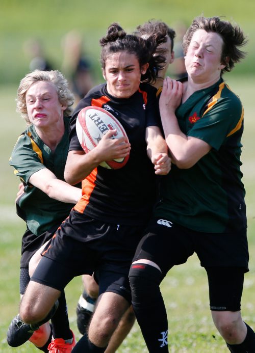 JOHN WOODS / WINNIPEG FREE PRESS
EastMan Storm's Ciaran Woods (11)(C) breaks through a tackle by North Saskatchewan Rugby Union (NSRU) players in a U-16 playoff game in the Man-Sask Rugby tournament in Brandon Sunday, July 9, 2017. EastMan, which includes Winnipeg, went on to defeat NSRU 34-7 and take home a third place in the tournament. Woods will represent the province in the upcoming National Rugby Tournament in Calgary.