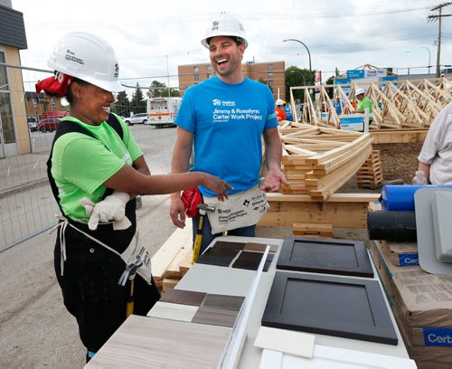 WAYNE GLOWACKI / WINNIPEG FREE PRESS

Soon to be a home owner Sara Tesfa gets help picking out her kitchen cabinets from HGTV star Scott McGillivray.   About 500 volunteers started building  20 homes on Lyle St. Monday morning as part of the Habitat for Humanitys 34th Jimmy & Rosalynn Carter Work Project¤ that runs July 9-14 in cities across Canada. Together they will be building 150 homes in celebration of Canadas 150th anniversary.Kevin Rollason story  July 10  2017