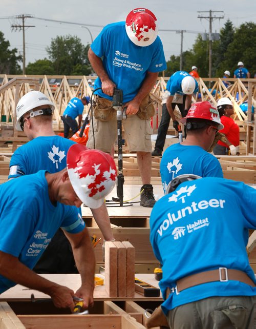 WAYNE GLOWACKI / WINNIPEG FREE PRESS

About 500 volunteers started building  20 homes on Lyle St. Monday morning as part of the Habitat for Humanitys 34th Jimmy & Rosalynn Carter Work Project¤ that runs July 9-14 in cities across Canada. Together they will be building 150 homes in celebration of Canadas 150th anniversary.Kevin Rollason story  July 10  2017