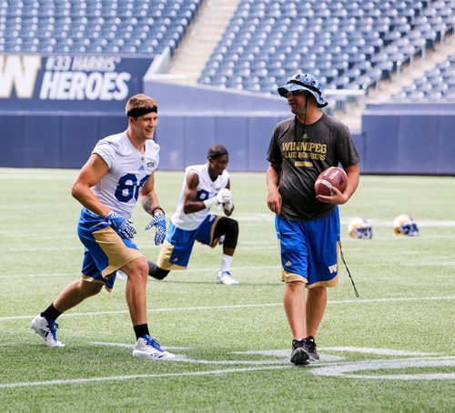 JUSTIN SAMANSKI-LANGILLE / WINNIPEG FREE PRESS
New Bombers recruit Drew Wolitarsky (Left) stretches during warmup at practice Monday.
170710 - Monday, July 10, 2017.