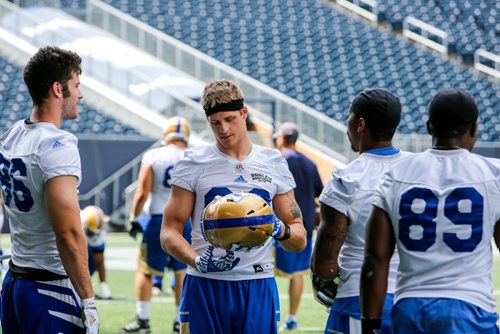 JUSTIN SAMANSKI-LANGILLE / WINNIPEG FREE PRESS
New Bombers recruit Drew Wolitarsky (Centre) talks with his teammates on the sideline during practice Monday.
170710 - Monday, July 10, 2017.