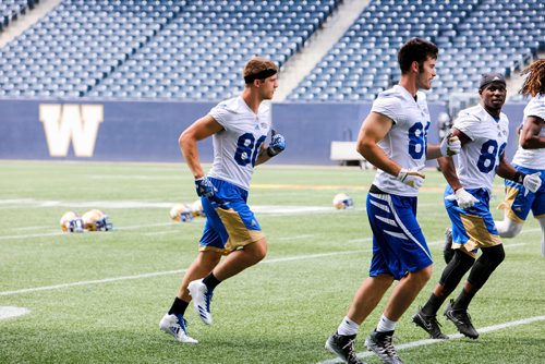 JUSTIN SAMANSKI-LANGILLE / WINNIPEG FREE PRESS
New Bombers recruit Drew Wolitarsky (Left) jogs during warmup at practice Monday.
170710 - Monday, July 10, 2017.