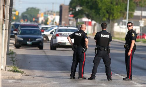 WAYNE GLOWACKI / WINNIPEG FREE PRESS

Winnipeg Police have closed Logan Ave. at Sherbrook St. Monday morning. A reported armed standoff after a break-in at a residence housing a grow-op resulted a stretch of Logan Avenue being closed early Monday morning. July 10  2017