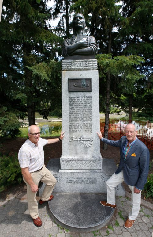 WAYNE GLOWACKI / WINNIPEG FREE PRESS

49.8 - Selkirk treaty.   Scots Gordon Cameron and John Perrin,right, with the Chief Peguis statute at Kildonan Park. Cameron is a direct descendant of Selkirk Settler, Donald Gunn. Perrin is a former president of the St. Andrews Society and head of the Scottish Heritage Council, a Mb cultural group. Both are organizers of a week-long series of events to mark the 200th anniversary of the Selkirk Treaty, a document unique in western Canadian history. Alex Paul story  July 10  2017