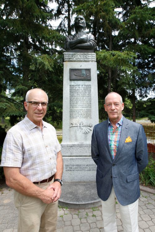 WAYNE GLOWACKI / WINNIPEG FREE PRESS

49.8 - Selkirk treaty.  Scots Gordon Cameron and John Perrin,right,  with the Chief Peguis statute at Kildonan Park. Cameron is a direct descendant of Selkirk Settler, Donald Gunn. Perrin is a former president of the St. Andrews Society and head of the Scottish Heritage Council, a Mb cultural group. Both are organizers of a week-long series of events to mark the 200th anniversary of the Selkirk Treaty, a document unique in western Canadian history. Alex Paul story  July 10  2017